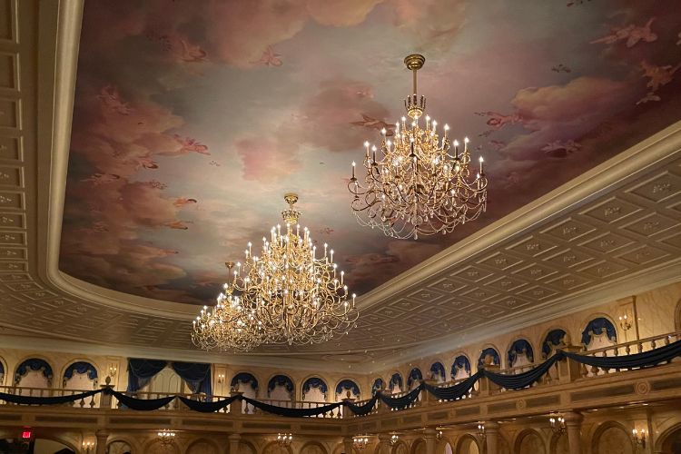 Be Our guest Ballroom chandeliers and painted ceiling