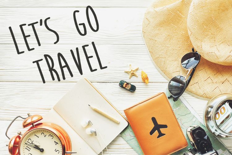 sun hat, lets go travel, travel journal, clock, pencil, headphones, sunglasses, cash