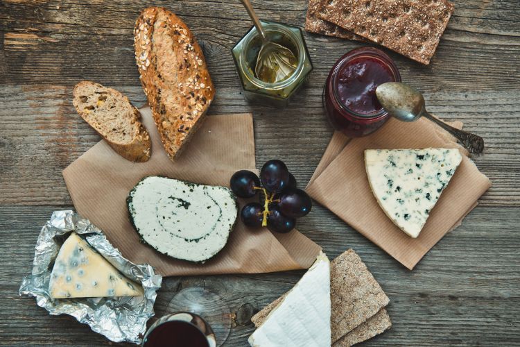 common french phrases for travel: Ordering food in french 

image of cheeses, jams, spoons ,grapes, bread