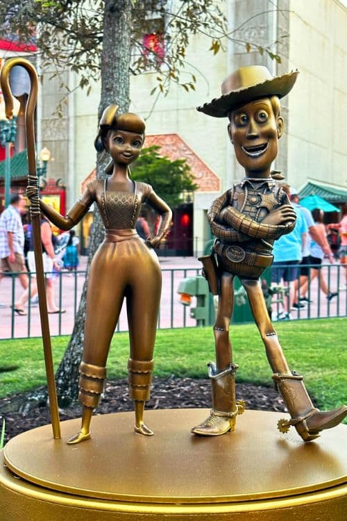 bo peep and woody gold statue at disney parks